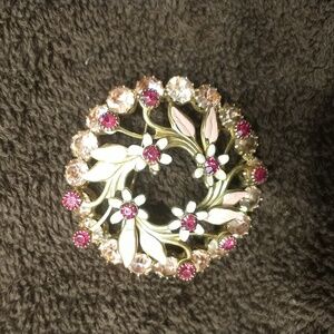 Floral rhinestone brooch.